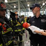 An infant "victim" is tended to during the emergency response drill.